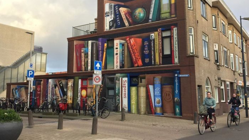 ¡Quedó hermoso! Artistas holandeses pintan una librería gigante en un edificio | FOTOS